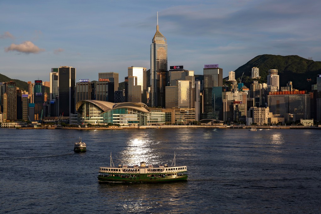 Hong Kong’s market entered bull territory Monday, after being in a bear market for more than three months due to upheaval by the coronavirus. Above, a Star Ferry boat crosses Victoria Harbour in front of a skyline of buildings. Photo: Reuters
