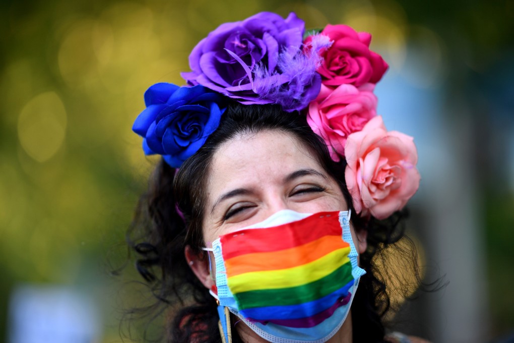 A demonstrator wearing a rainbow face mask attends the 2020 Critical Pride parade in Madrid, Spain on June 28. While some activists took to the streets to mark the event, much of the movement’s energy was channelled into Global Pride, a 24-hour online event broadcast live online. Photo: AFP