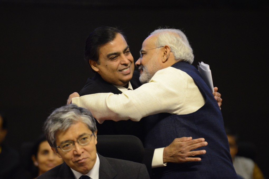 Indian Prime Minister Narendra Modi (right) greets the country’s richest man, Mukesh Ambani. The family is hugely wealthy and well connected. Photo: Sam Panthaky/AFP