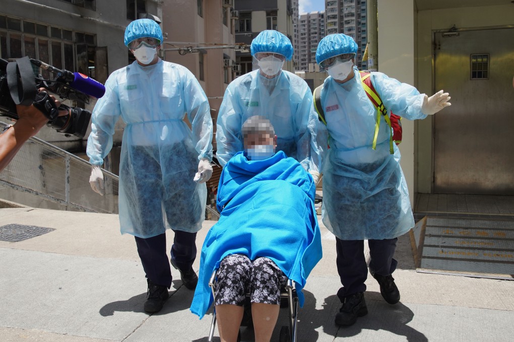 An elderly woman suspected of having the coronavirus is taken away from the Kong Tai Care for the Aged Centre in Tsz Wan Shan for hospital treatment. Photo: Winson Wong