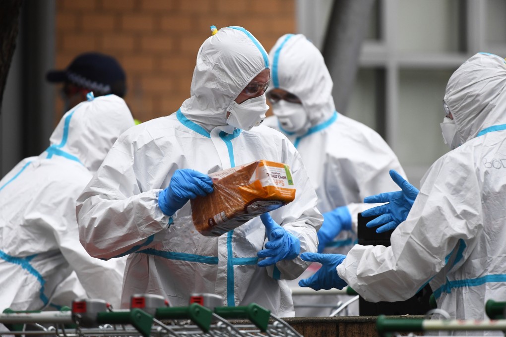 About 3,000 residents of public housing tower blocks are barred from leaving their apartments even for food. Photo: EPA