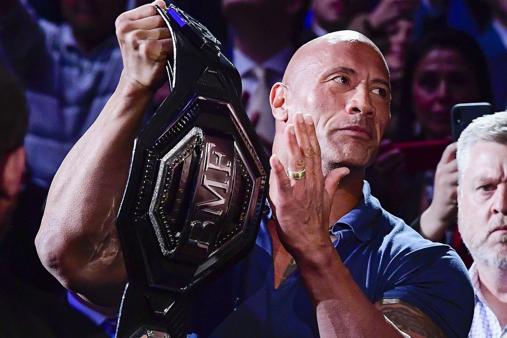 Dwayne ‘The Rock’ Johnson holds the ‘BMF’ belt before a welterweight bout between Jorge Masvidal and Nate Diaz at UFC 244 in Madison Square Garden, New York in November of 2019. Photo: AFP