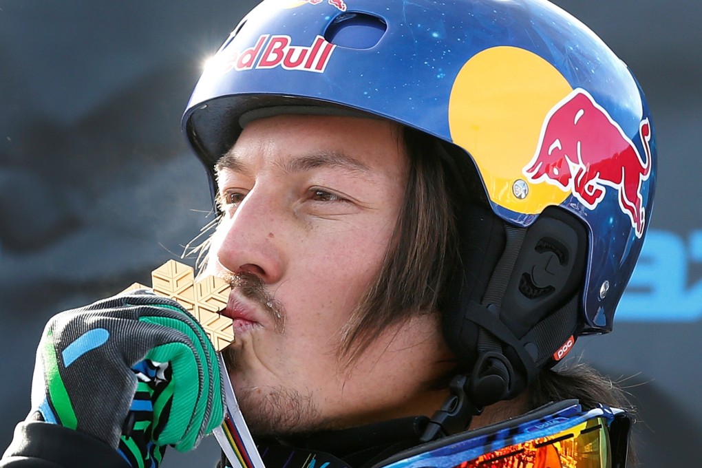Australia’s Alex Pullin kisses his medal after the men’s snowboard-Cross finals at the 2013 FIS Snowboard World Championships in Stoneham, Quebec. Photo: Reuters