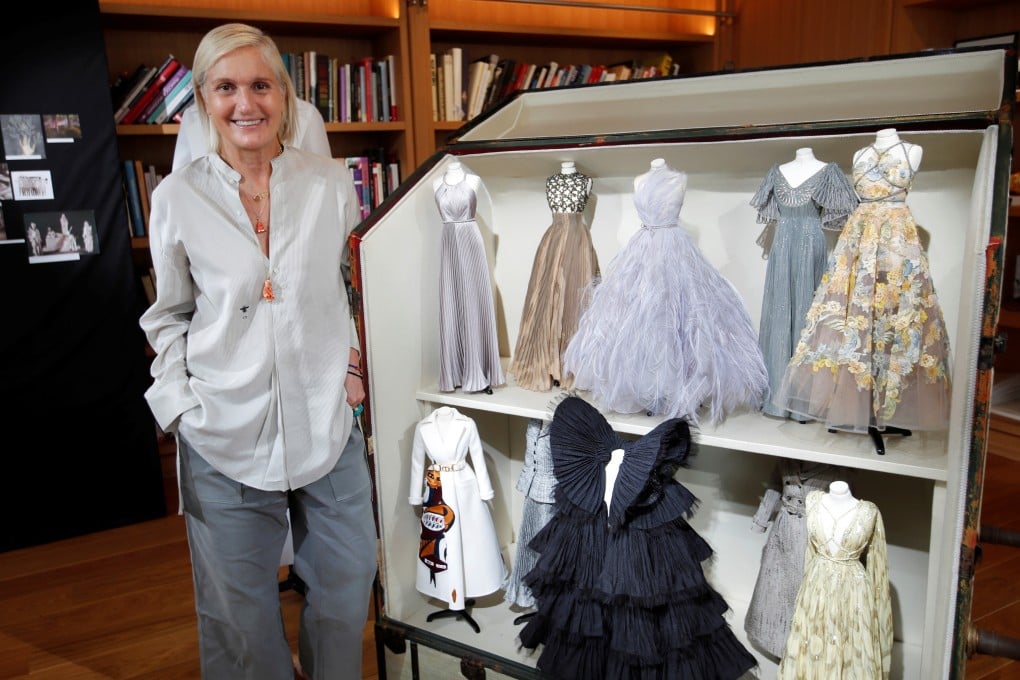 Maria Grazia Chiuri, designer for fashion house Dior, poses next to her haute couture creations on miniature mannequins. The dolls in couture echo a similar show French couturiers put together amid post-war austerity in 1945, and which kick-started an haute couture renaissance. Photo: Reuters