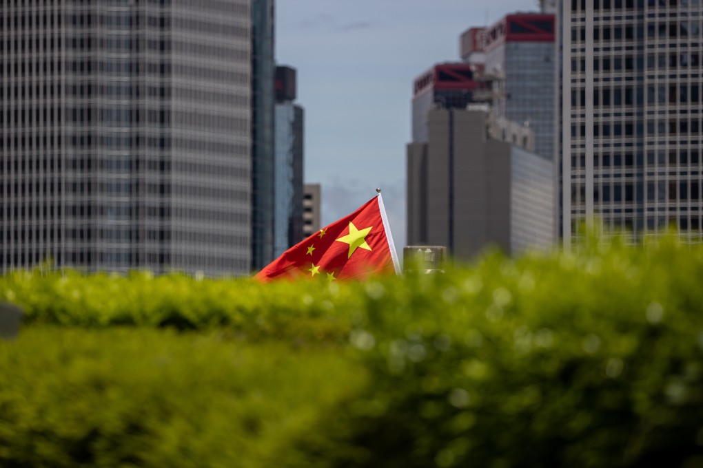 A Chinese flag is held aloft during a rally in Hong Kong in support of the national security law on June 30. Photo: EPA-EFE