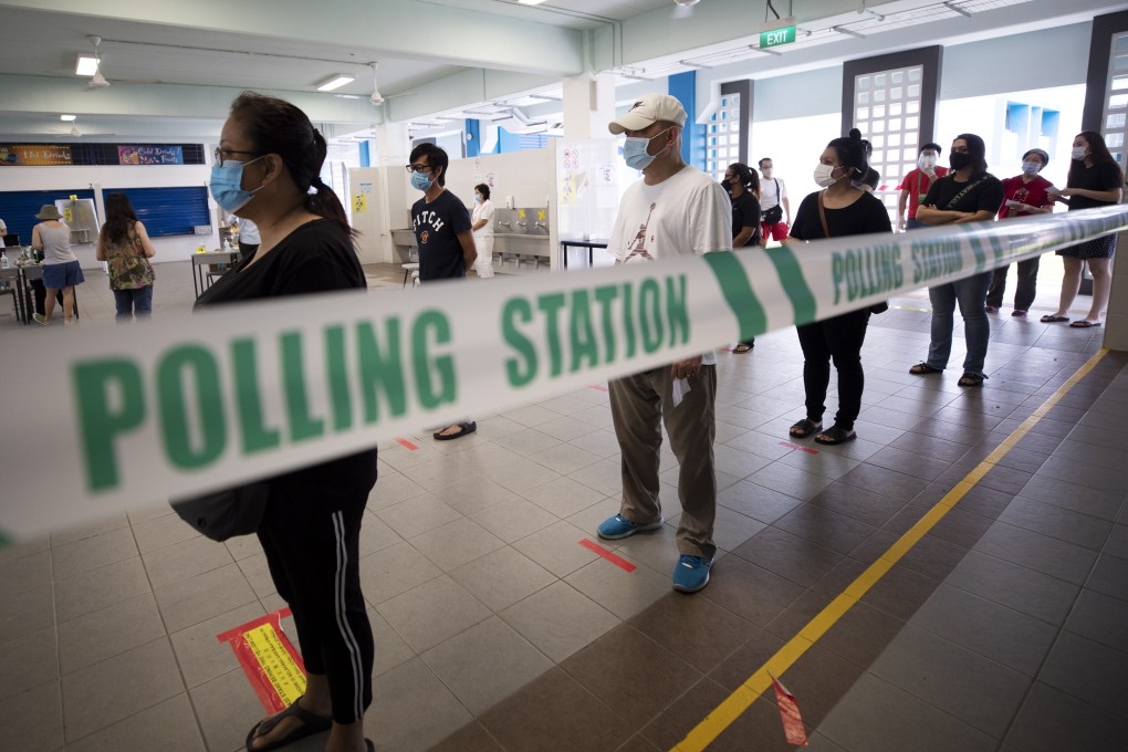 Voters queue to cast their ballots at a polling station in Singapore on July 10, 2020. Photo: EPA-EFE
