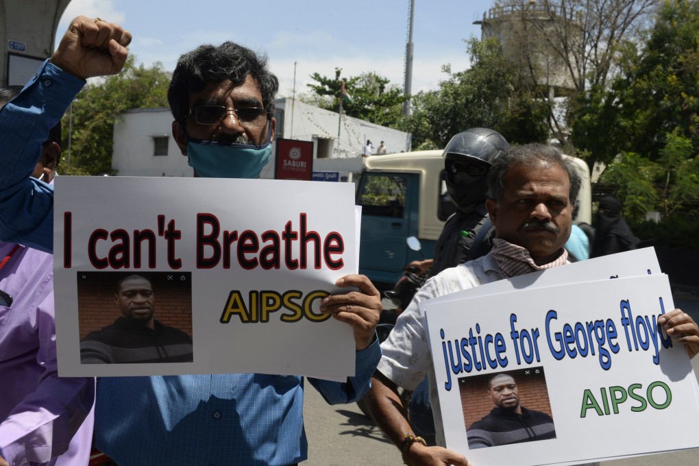 Members of the All India Peace and Solidarity Organisation hold placards in a silent protest in front of the Consulate General of the United States in Hyderabad on June 4 in solidarity over the death of George Floyd. Photo: AFP