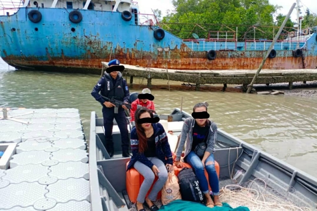 A handout photo made available by Johor police showing people smugglers and immigrants in a boat shortly before their arrest. Photo: Handout / Johor police