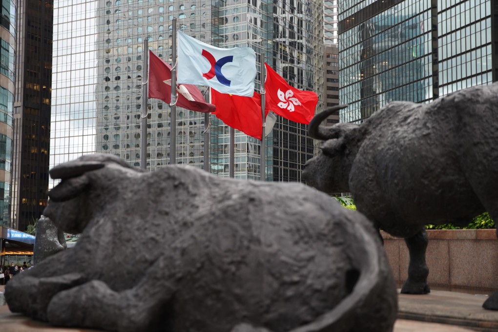 Hong Kong is seeing a rush of listings on its main board, defying doomsday predictions that the controversial national security law would scare off investors. Here, bronze sculptures of bulls and the flag of the Hong Kong exchange are pictured. Photo: Winson Wong