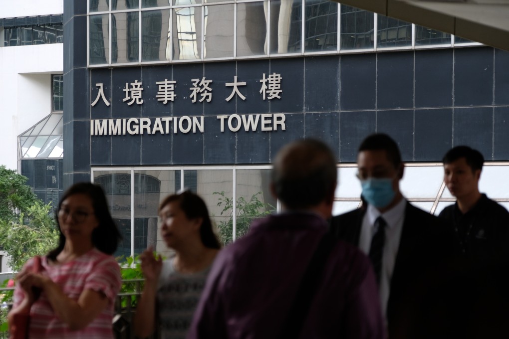 People walk past Immigration Tower in Wan Chai in October 2018. In response to the Covid-19 pandemic, Hong Kong has launched new measures to allow non-local graduates to apply for visas online. Photo: Fung Chang
