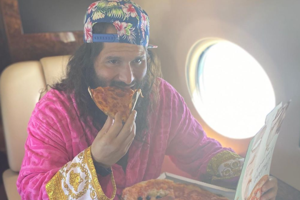 Jorge Masvidal eats pizza on the way to UFC 251 on Fight Island in Yas Island, Abu Dhabi. Photo: Instagram/Jorge Masvidal