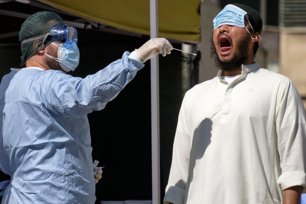 A man has a swab taken to test for Covid-19 outside a health care centre in Rome on Thursday. Photo: LaPresse via AP