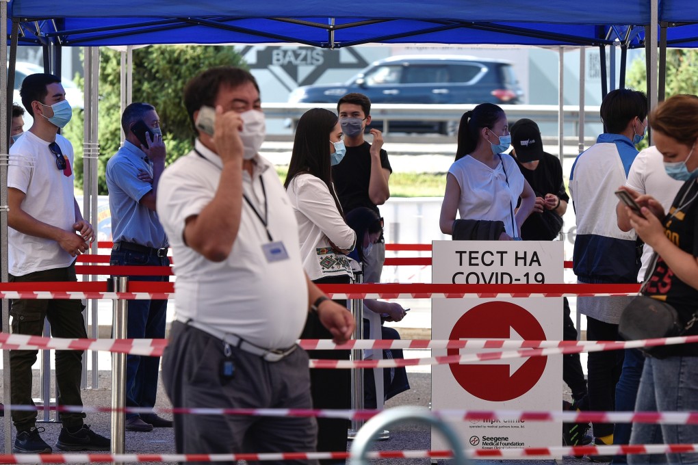People queue in front of a coronavirus disease testing facility in Almaty, Kazakhstan, on Wednesday. Photo: Reuters