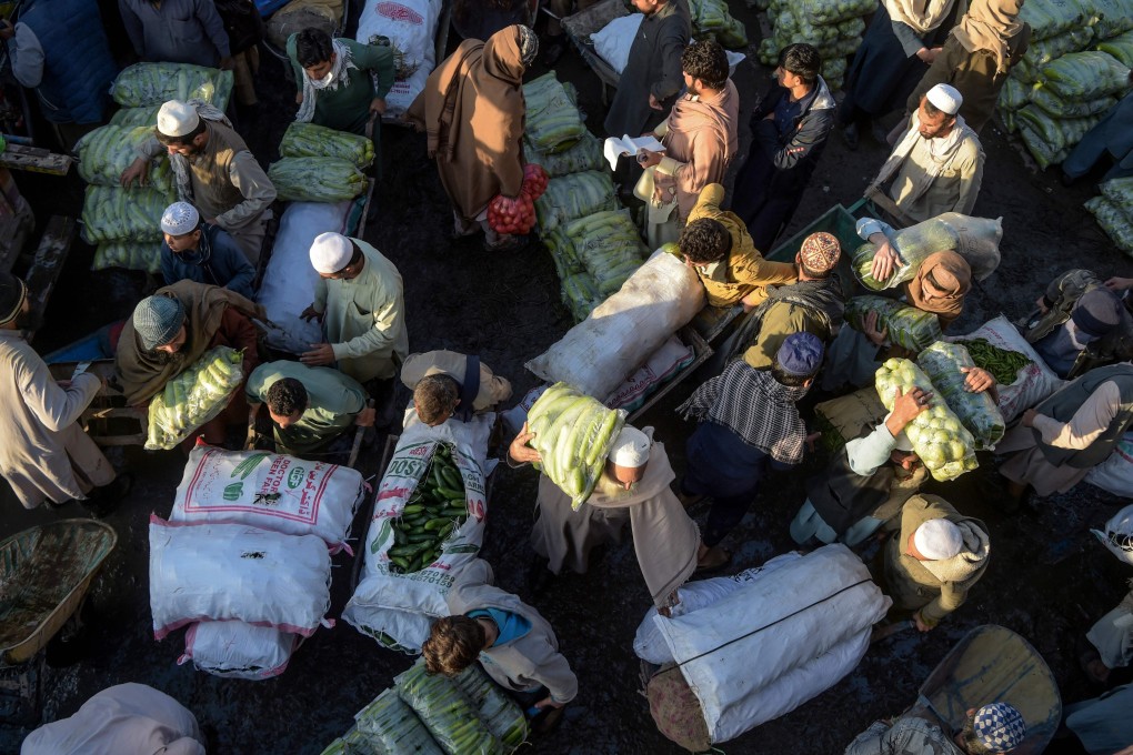 Traders and customers gather at a crowded vegetable market in Peshawar, Pakistan, on April 2 during a government-imposed nationwide lockdown as a preventive measure against Covid-19. While Pakistan’s population has almost quadrupled since 1970, its economic growth has not kept pace and fallen far behind many economies in East Asia. Photo: AFP