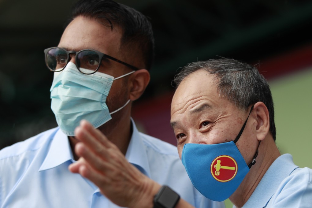 Singapore Workers’ Party chief Pritam Singh (left) and former chief Low Thia Khiang at a campaign walkabout on Wednesday. Photo: EPA-EFE