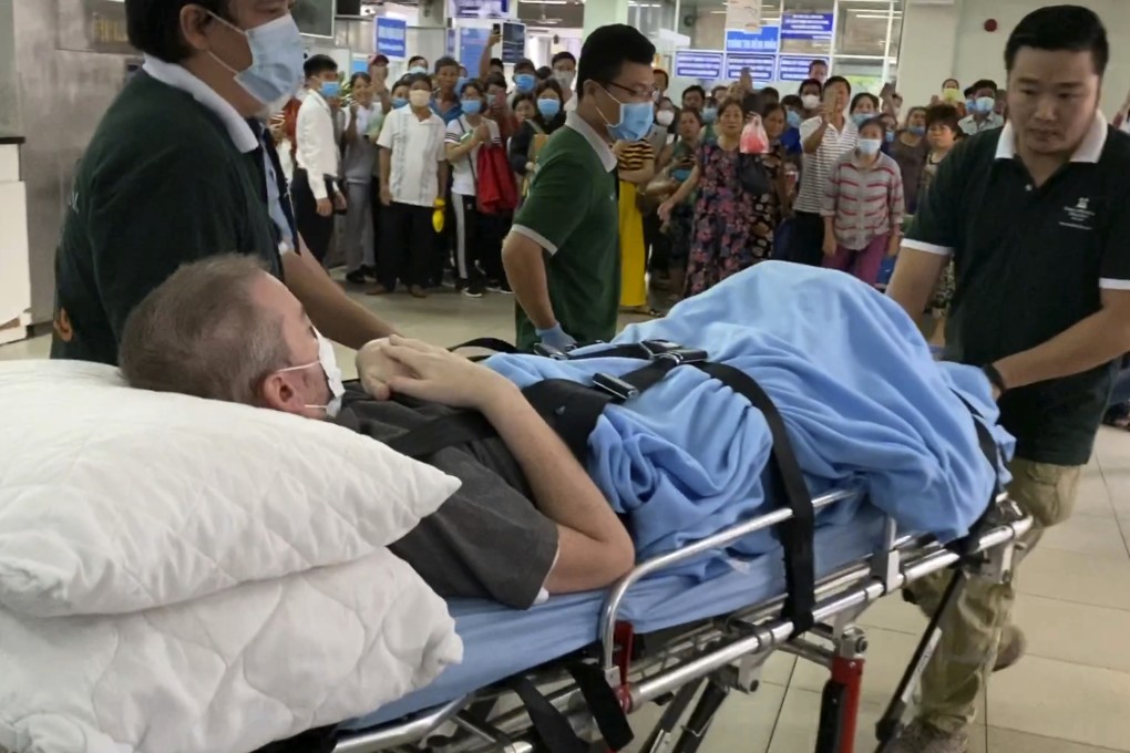 Stephen Cameron is wheeled out of the hospital to the airport to leave Vietnam on July 11, 2020. Photo: EPA-EFE