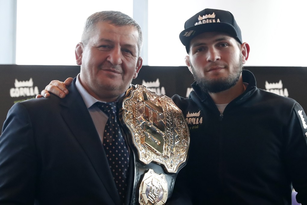 Khabib Nurmagomedov and his trainer and father, Abdulmanap, at a press conference in Moscow in November 2018. Photo: EPA