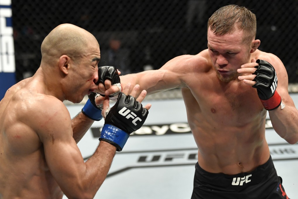 UFC bantamweight champion Petr Yan punches Jose Aldo in their title fight at UFC 251 on Fight Island, Abu Dhabi. Photo: USA Today
