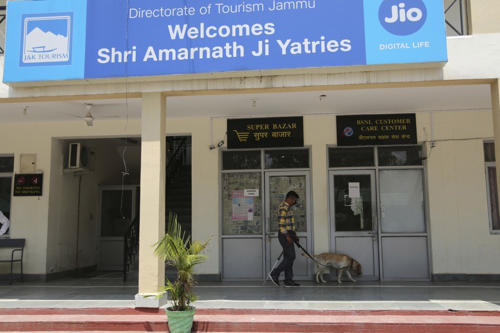 A policeman secures an area in Jammu, India, at the base camp of the pilgrimage to the Amarnath cave. Photo: AP