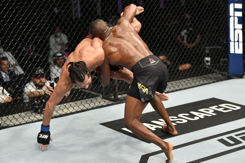 Kamaru Usman takes down Jorge Masvidal in their UFC welterweight championship fight during UFC 251. Photo: Jeff Bottari/Zuffa LLC