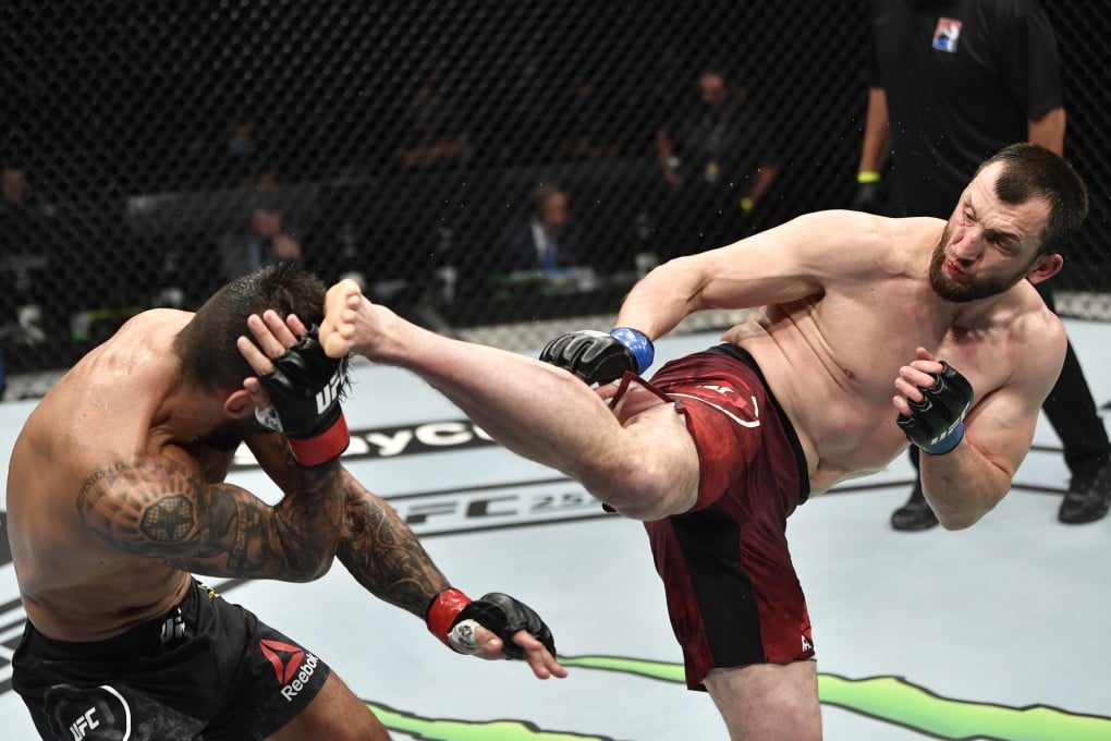 Muslim Salikhov kicks Elizeu Zaleski dos Santos in their welterweight fight during UFC 251. Photos: USA TODAY Sports