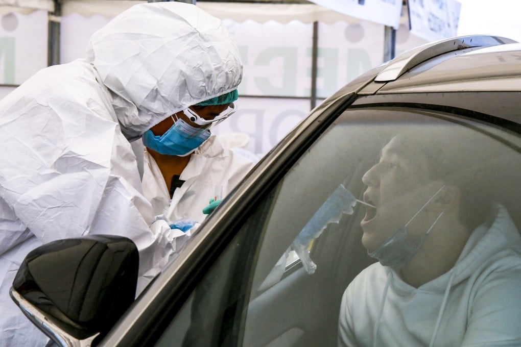 A motorist is given a Covid-19 test in Almaty, Kazakhstan’s largest city. Photo: AFP