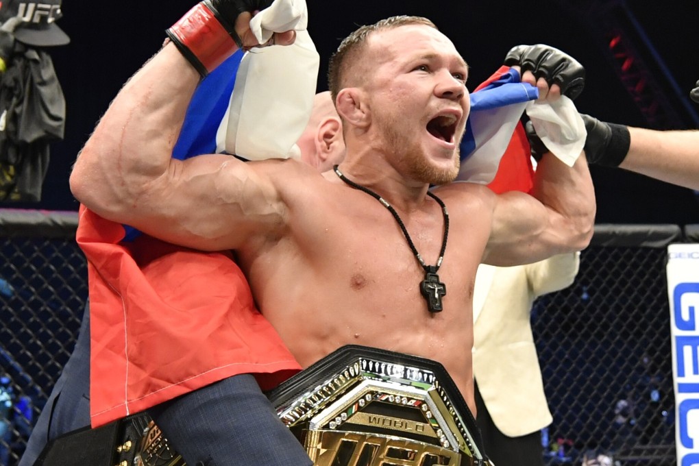 Petr Yan celebrates after his TKO victory over Jose Aldo in their UFC bantamweight title fight during UFC 251. Photos: USA TODAY Sports