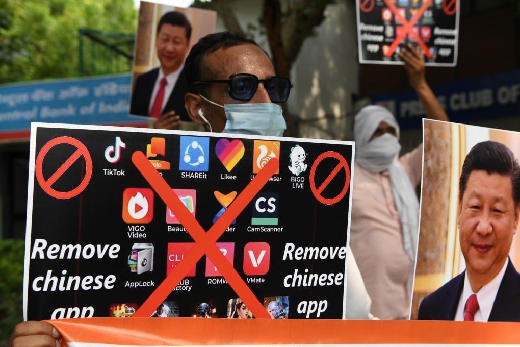 Activists in India hold placards urging citizens to remove Chinese apps and stop using Chinese products during a demonstration against the Chinese newspaper Global Times in New Delhi on June 30, 2020. Photo: AFP