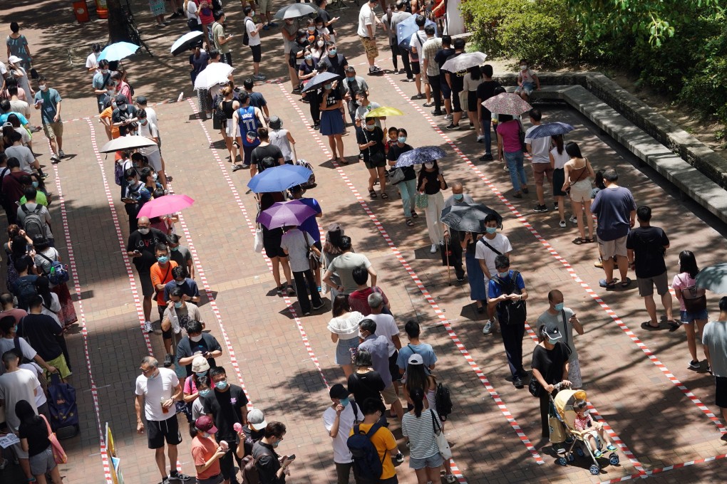 People queue up in Hong Kong’s Tai Po area on Sunday to vote in an opposition camp primary, as similar scenes unfolded across the city. Photo: Felix Wong