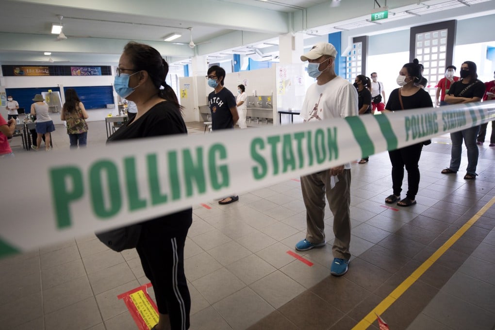 Voters queue to cast their ballots at a polling station in Singapore. Photo: EPA