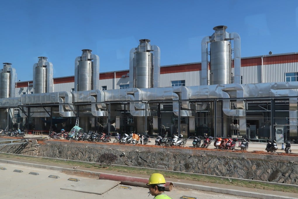 A worker walks past a battery factory of Contemporary Amperex Technology in Ningde in December 2016. Photo: Reuters