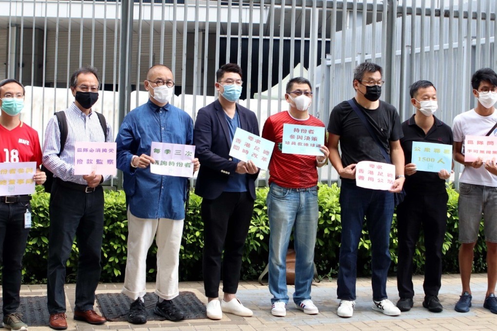 Legco Home Affairs Panel chairman Lau Kwok-fan (fourth from left) receives petition letters from a football fans' concern group before the panel meeting. Photo: Chan Kin-wa