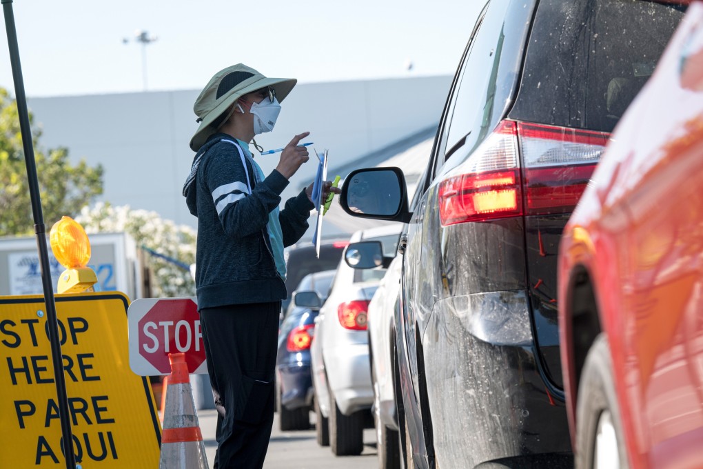 A nurse wearing a protective mask checks in a patient for a Covid-19 test in Concord, California, on Thursday. Photo: Bloomberg