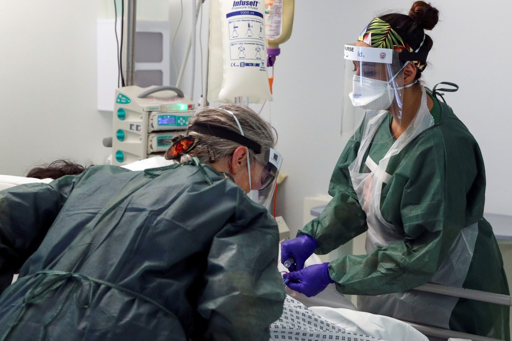 Nurses attend to a coronavirus patient at Frimley Park Hospital in Surrey, Britain, in May. Photo: Reuters