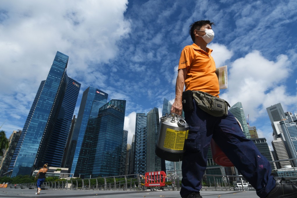 A worker delivers goods in Singapore. Photo: Xinhua