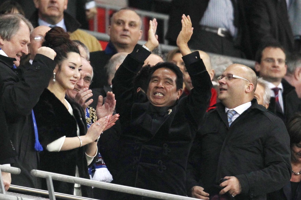 Birmingham City's owner, Hong Kong businessman Carson Yeung (C) celebrates at the end of the 2011 Carling Cup final. Photo: AFP