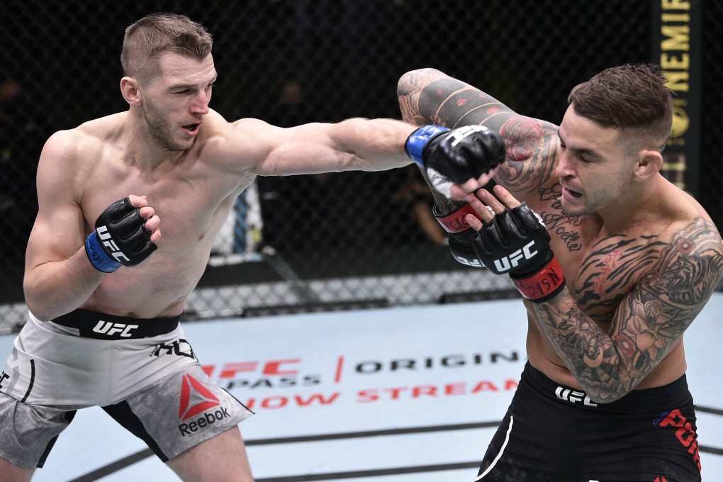 Dan Hooker punches Dustin Poirier during their UFC Fight Night bout. Photo: Chris Unger/Zuffa LLC via USA TODAY Sports