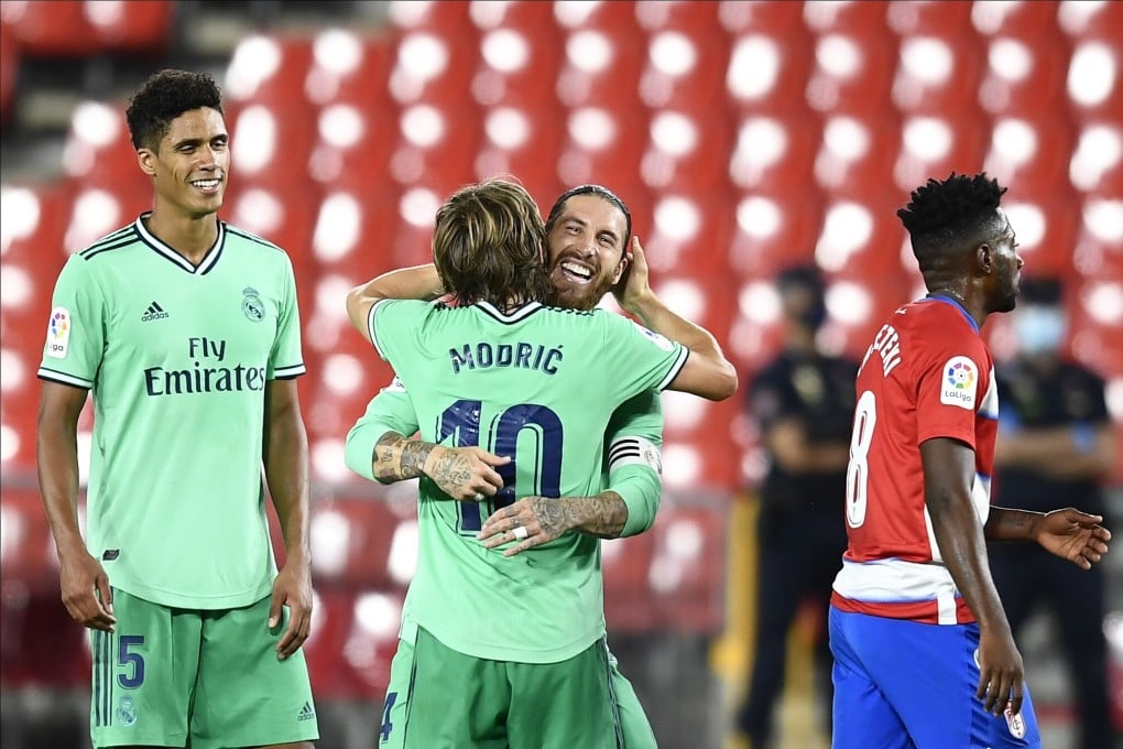 Real Madrid captain Sergio Ramos celebrates with his teammate Luka Modric after the win over Granada. Photo: AP