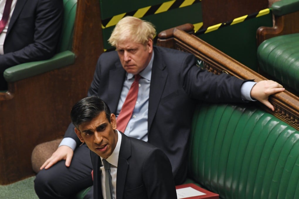 Britain's Prime Minister Boris Johnson listens to Britain's Chancellor of the Exchequer Rishi Sunak deliver his mini-budget in the House of Commons, London, 8 July 2020. China has warned Johnson will face ‘consequences’ if the UK treats it as a ‘hostile partner.’ Photo: EPA-EFE