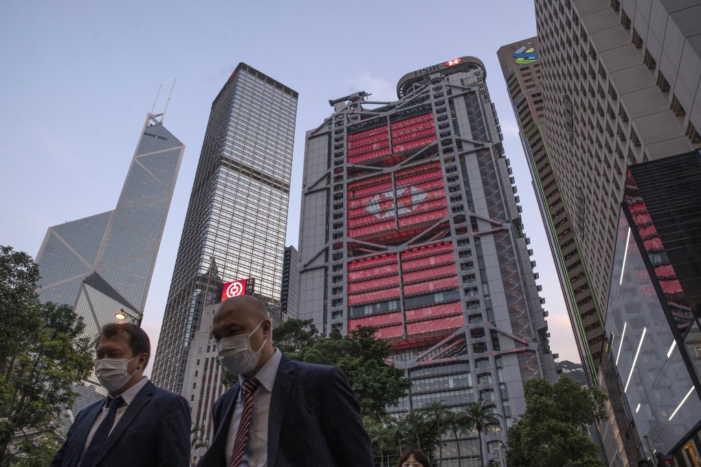 Pedestrians in Hong Kong’s Central business district, with the Bank of China Tower (left), Cheung Kong Center (second left) and HSBC headquarters building (cente) in the background, on Monday, April 27, 2020. Photo: Bloomberg