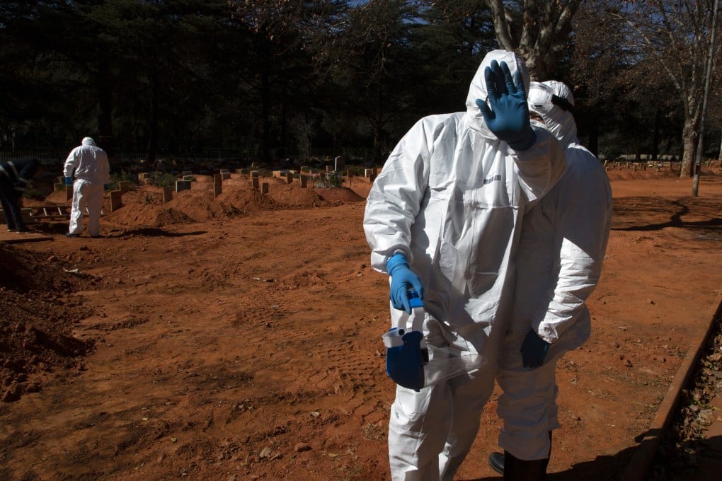 Undertakers in protective personal equipment prepare for a Muslim burial at Westpark Cemetery in Johannesburg on Tuesday. South Africa has become the leading coronavirus-infected nation on the African continent. Photo: AP