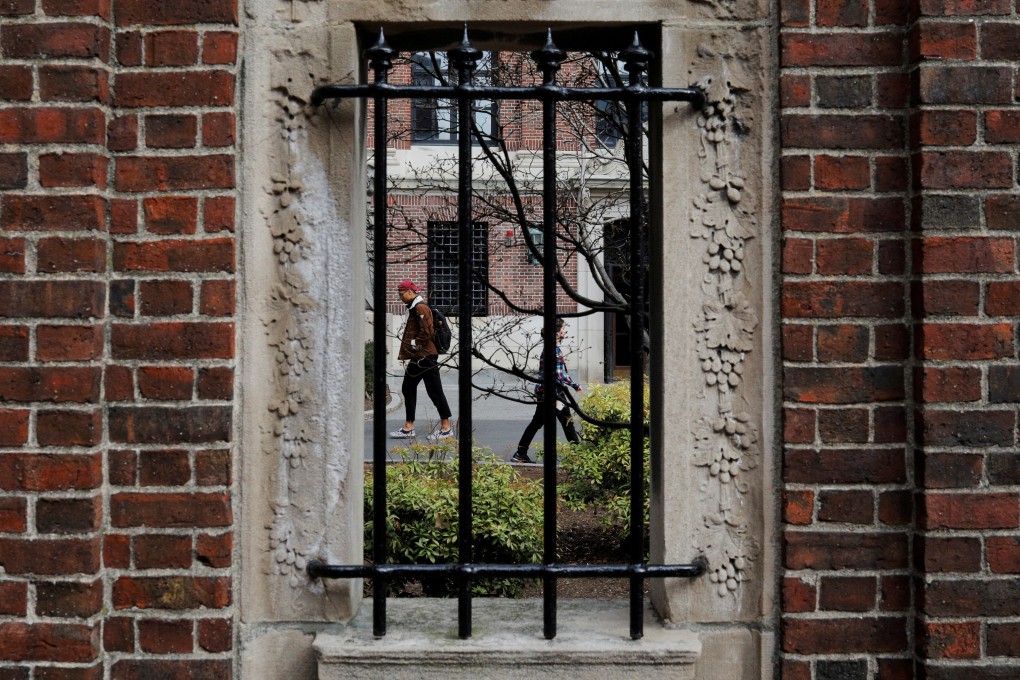 Students and pedestrians walked through the Yard at Harvard University, after the school said in March it would move to virtual instruction. Photo: Reuters
