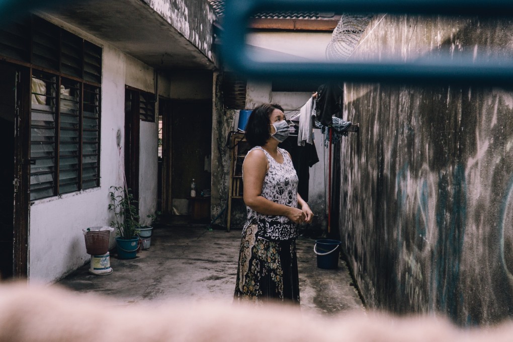 Sabe Phyu in the courtyard in Kuala Lumpur where she lives. Photo: Benjamin