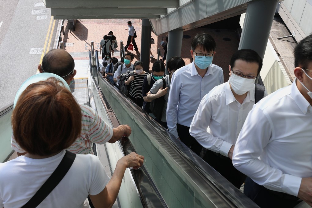 Civil servants return to their offices at the government headquarters in Admiralty on May 4, after weeks of working from home due to a coronavirus outbreak. Photo: Nora Tam