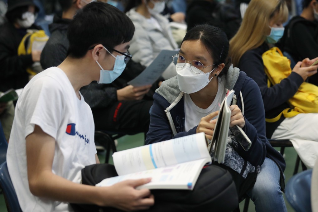 Secondary school students do a final revision while waiting to enter an exam hall for the DSE exam at Lions College in Kwai Chung on April 25. Photo: Xiaomei Chen