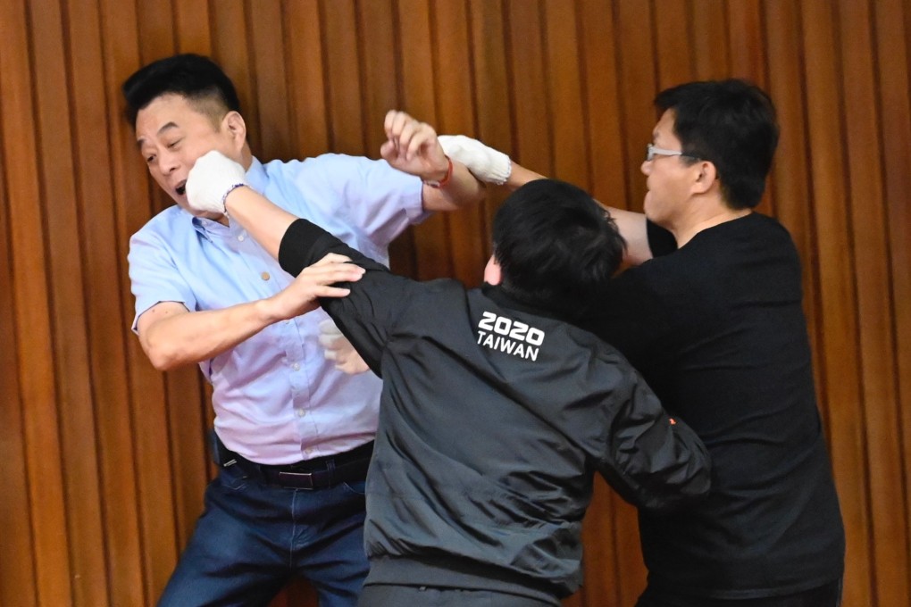 Scuffles break out during voting at Taiwan’s parliament on Friday between opposition and government lawmakers. Photo: AFP