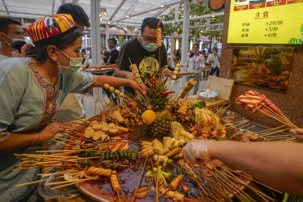 A snack stand at Urumqi’s grand bazaar earlier this month. The capital of northwest China’s Xinjiang autonomous region went into sudden lockdown on Thursday after its first coronavirus cases in months. Photo: Xinhua