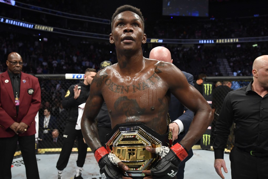 Israel Adesanya celebrates after defeating Yoel Romero in their middleweight championship fight during UFC 248. Photo: Jeff Bottari/Zuffa LLC