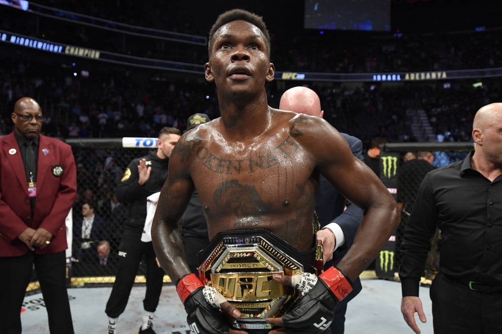 Israel Adesanya celebrates after defeating Yoel Romero in their middleweight championship fight during UFC 248. Photo: Jeff Bottari/Zuffa LLC