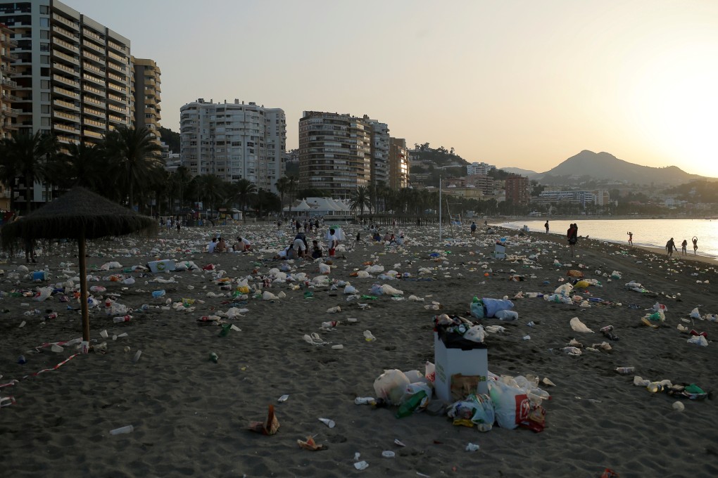 Malagueta beach in Malaga, Spain, is strewn with plastic bags and bottles after the summer solstice in June 2018. Microplastics from disintegrating plastic waste and other sources are increasingly working their way into the food supply. Photo: Reuters
